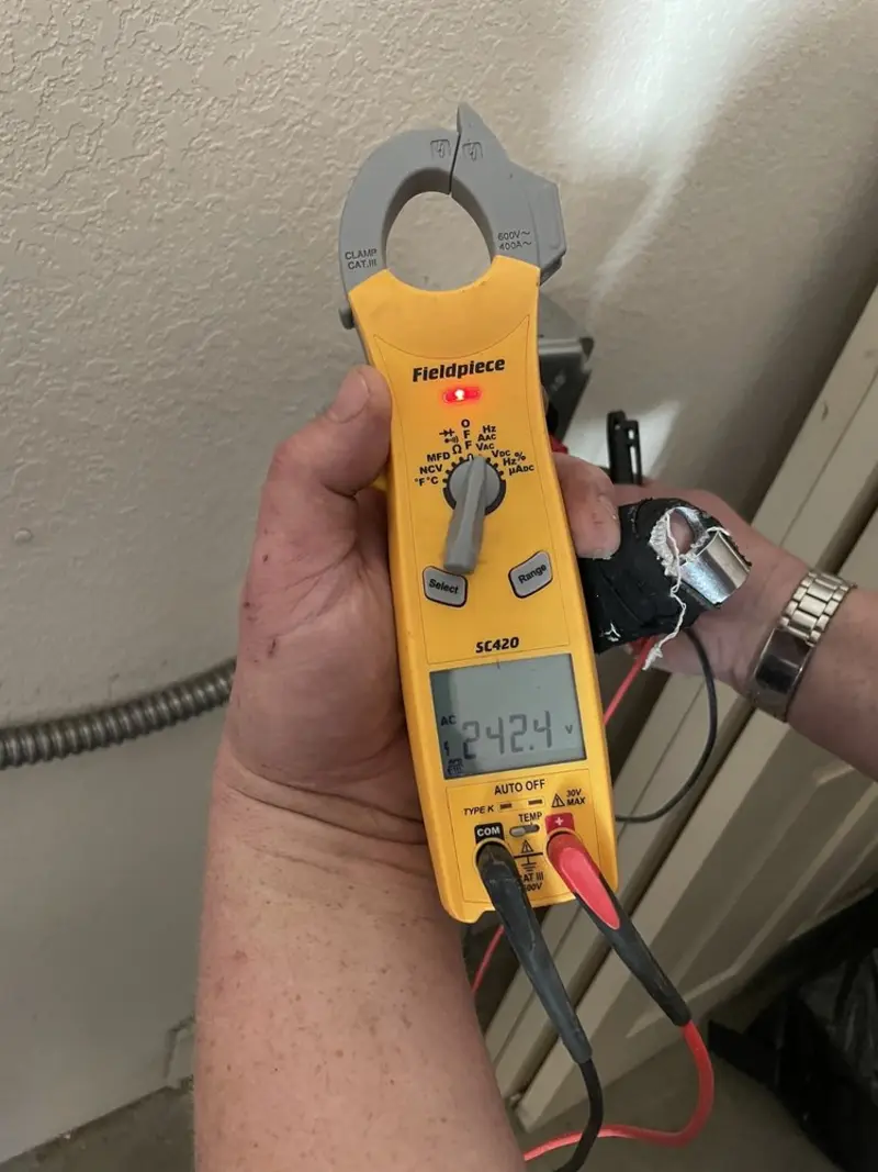 Voltage testing with clamp meter during Recessed Lighting Installation in Metamora
